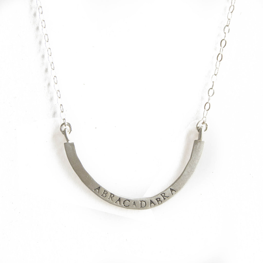 abracadabra cup half full necklace