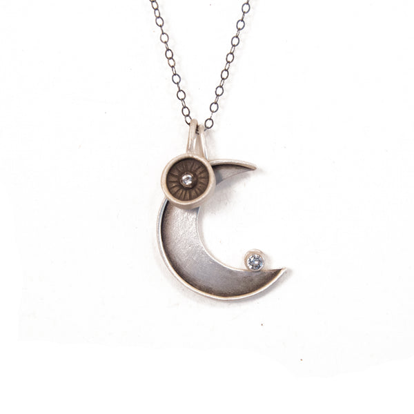 faceted crescent necklace with radiant circle