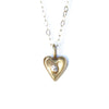 tiny gold heart with faceted gem