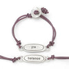 This bracelet has a pewter charm on colored leather with the word 