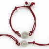 This bracelet has a pewter charm on colored leather with the word 